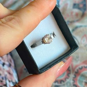 Size 8 stainless steel metal with 1/4 ct mossanite ring